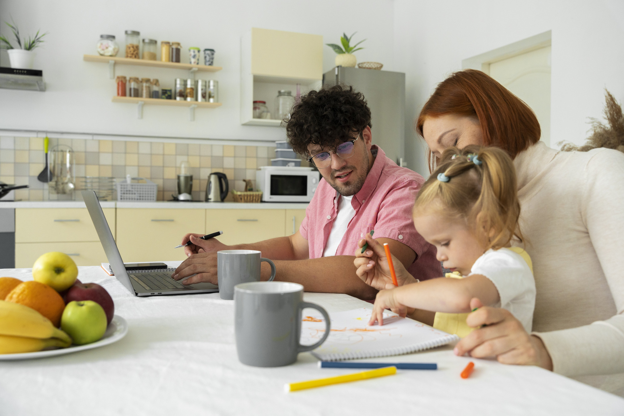 Parents and a young child sharing a quiet moment at home.